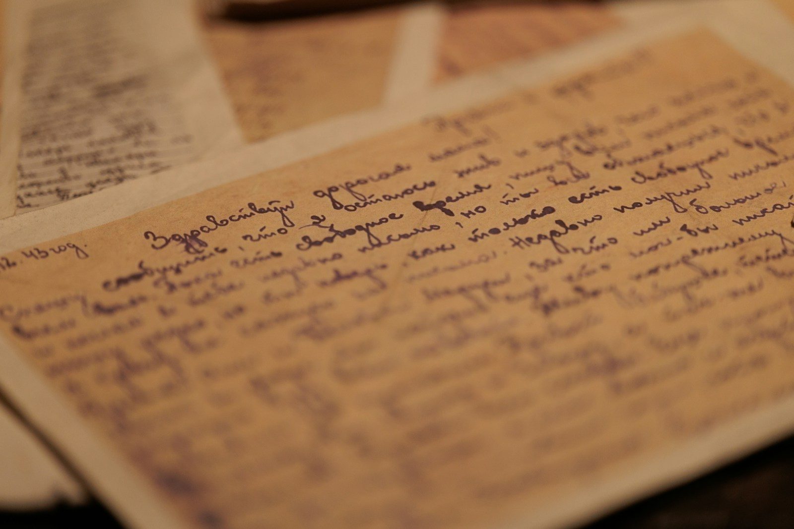 Handwritten notes on aged paper with blue ink